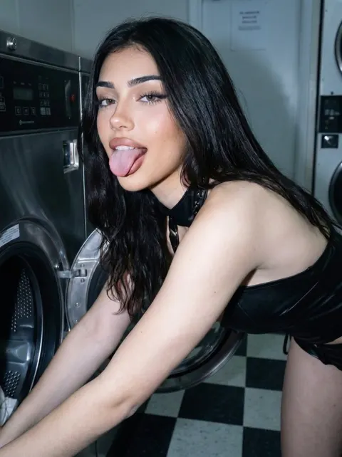 Eliza sticking her tongue out at the laundromat